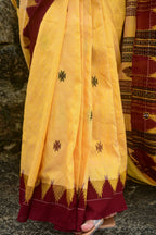 Arunima Kotpad natural dye saree flat lay — full length yellow Tussar Cotton Silk with kumbha border and tribal pallu