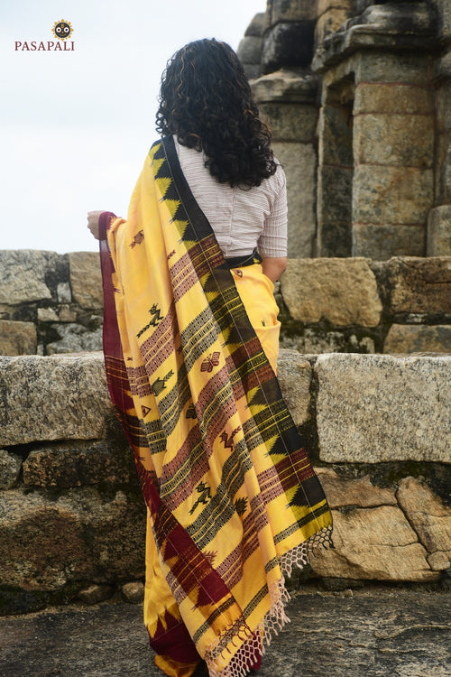 Arunima Kotpad saree overall view — aal bark dyed yellow ground, macha pharsa motifs, Mirgan weavers Pasapali Odisha