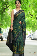 Full view of deep green Sambalpuri mercerized cotton saree with striped buta body and yellow flower at hem, Pasapali.