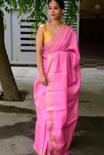 Load image into Gallery viewer, Close-up of golden zari border on pink Sambalpuri Tussar Silk saree by Pasapali, handwoven using Bandhakala double ikat technique.
