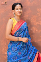 Barshika Blue Sambalpuri cotton saree front drape — Bandha double ikat weave with peacock body motifs by Pasapali