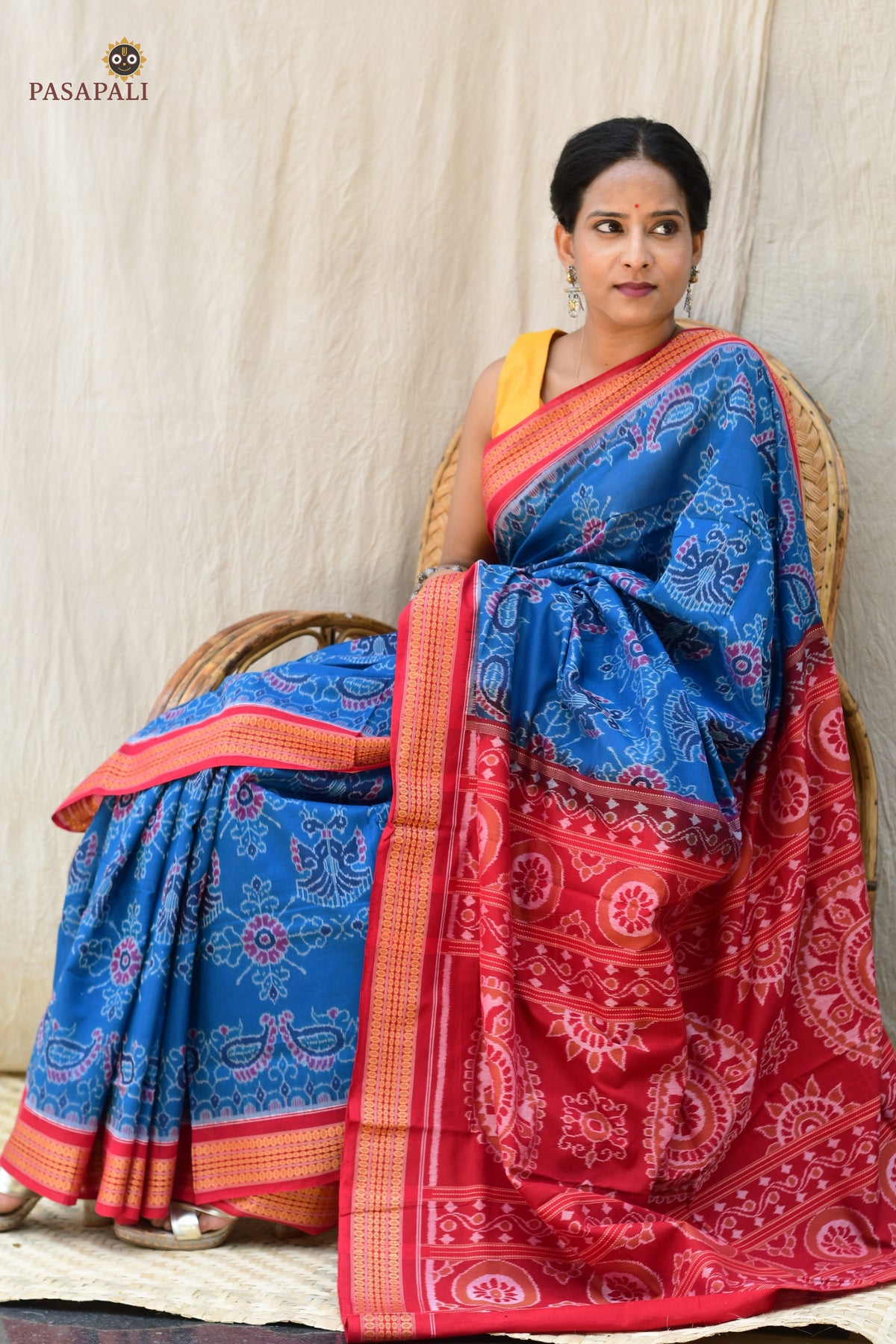 Barshika Blue Sambalpuri cotton saree neatly folded — Rudraksha border and red pallu visible, Pasapali handloom