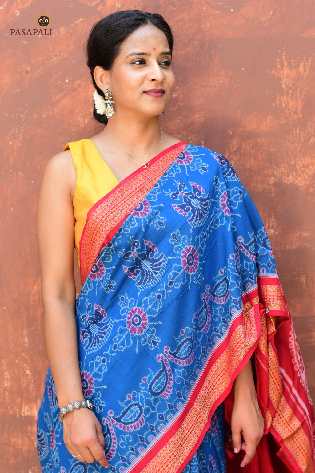 Handloom drape view of Barshika — authentic Sambalpuri Bandha cotton saree in blue and red from Pasapali Odisha