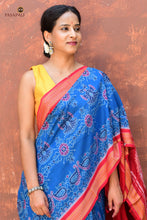 Load image into Gallery viewer, Handloom drape view of Barshika — authentic Sambalpuri Bandha cotton saree in blue and red from Pasapali Odisha
