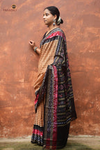 Basundhara light brown Sambalpuri Bandha mercerized cotton saree by Pasapali — full hero view showing check body and Pasapali border