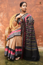 Basundhara pallu close-up — traditional flower motifs, bird and phula lata in Bandha double ikat on light brown mercerized cotton