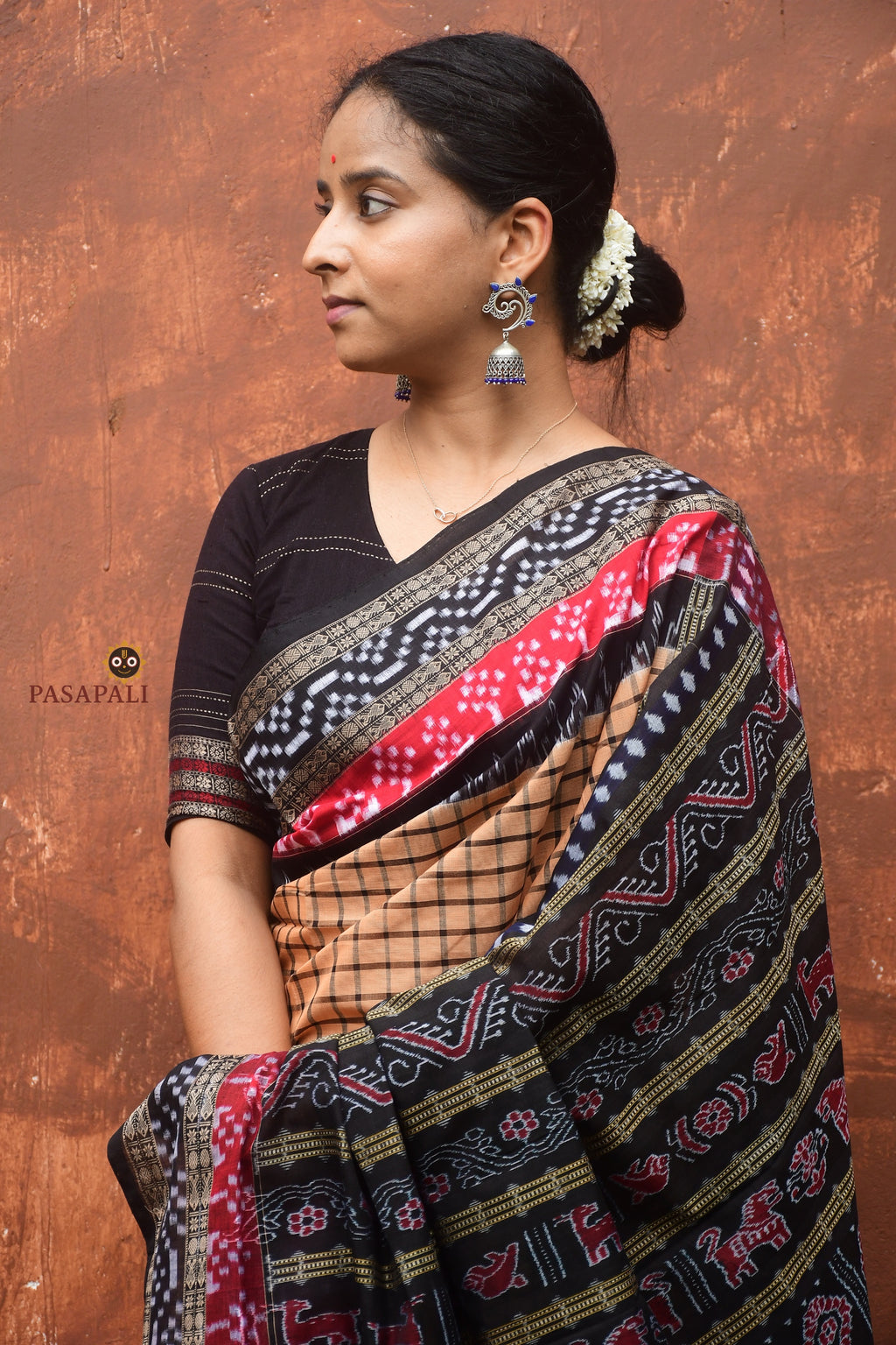 Handloom drape view of Basundhara — Sambalpuri Bandha saree in light brown mercerized cotton with phula lata pallu, Pasapali
