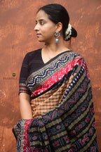 Handloom drape view of Basundhara — Sambalpuri Bandha saree in light brown mercerized cotton with phula lata pallu, Pasapali