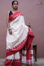 Close-up of kumbha border on Bhoomi Kotpad saree — raised temple form via multi-shuttle interlocking, red on off-white