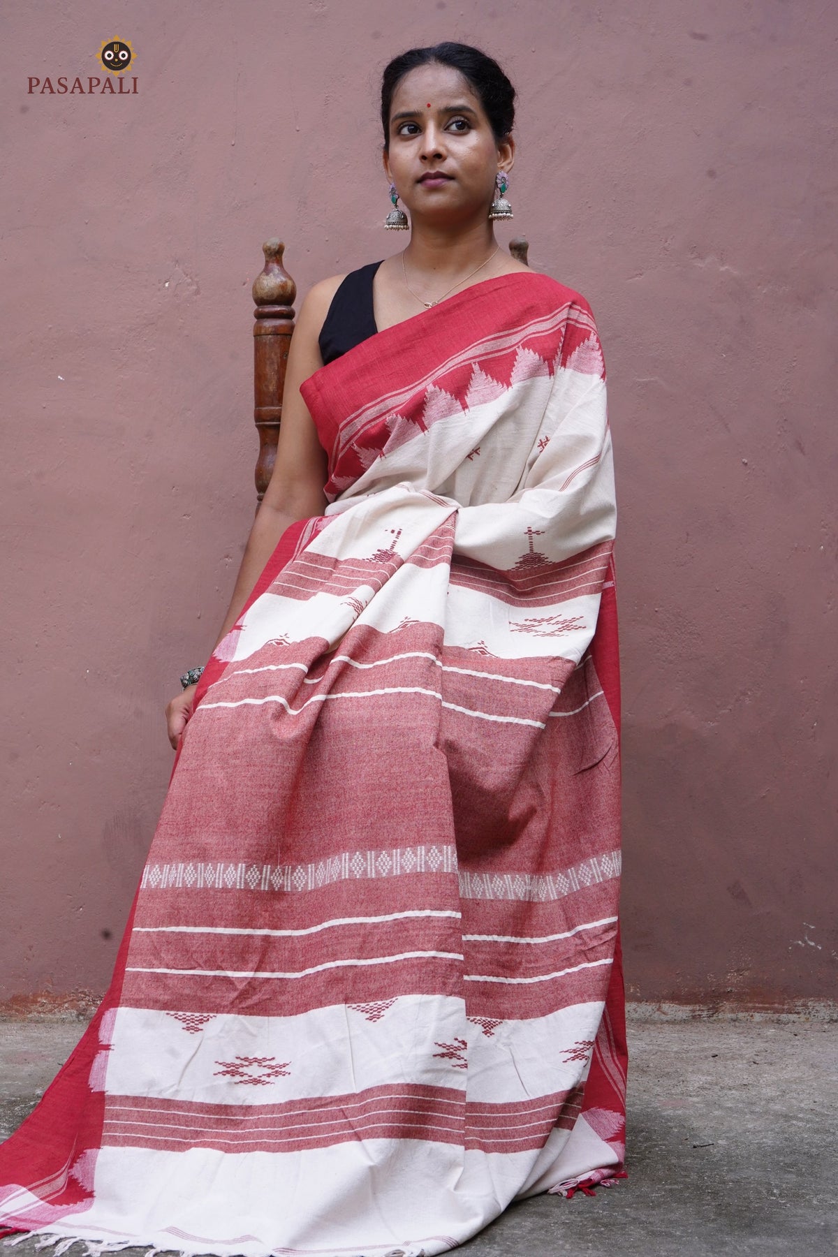 Bhoomi Kotpad handloom cotton saree — drape view showing weave movement and earthy off-white aal bark tone