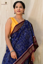 Load image into Gallery viewer, Folded view of blue Sambalpuri cotton saree showing jhoti body motifs and Rudraksha border
