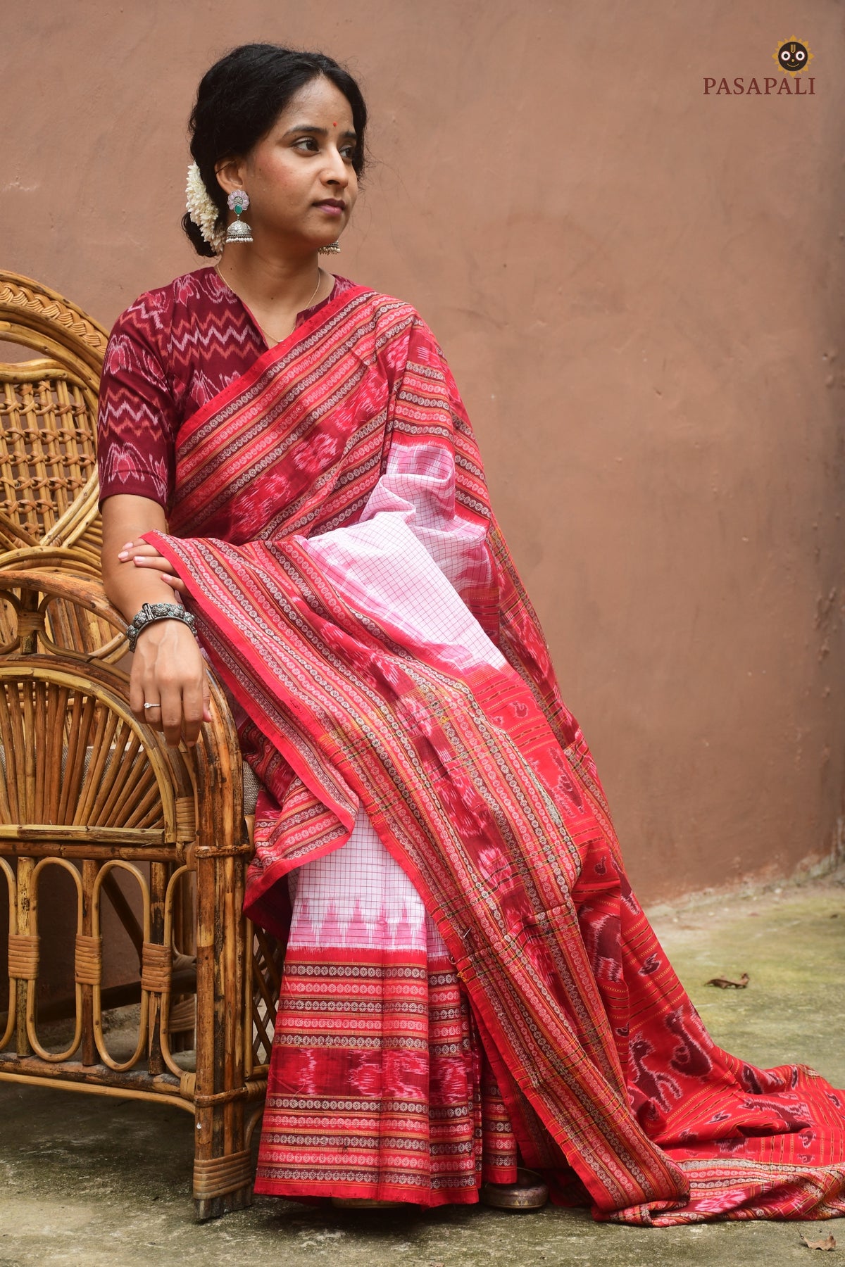 Charushila pallu detail — flower, fish, duck, deer, elephant ikat motifs on white Sambalpuri Handloom cotton saree