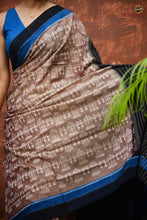Load image into Gallery viewer, Chitralekha body weave detail – tribal motifs in light brown Sambalpuri Bandha mercerized cotton, Pasapali
