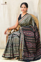 Tribal motif body weave detail on Chitrangada grey Sambalpuri Bandha saree — double ikat resist-dyed threads, Pasapali