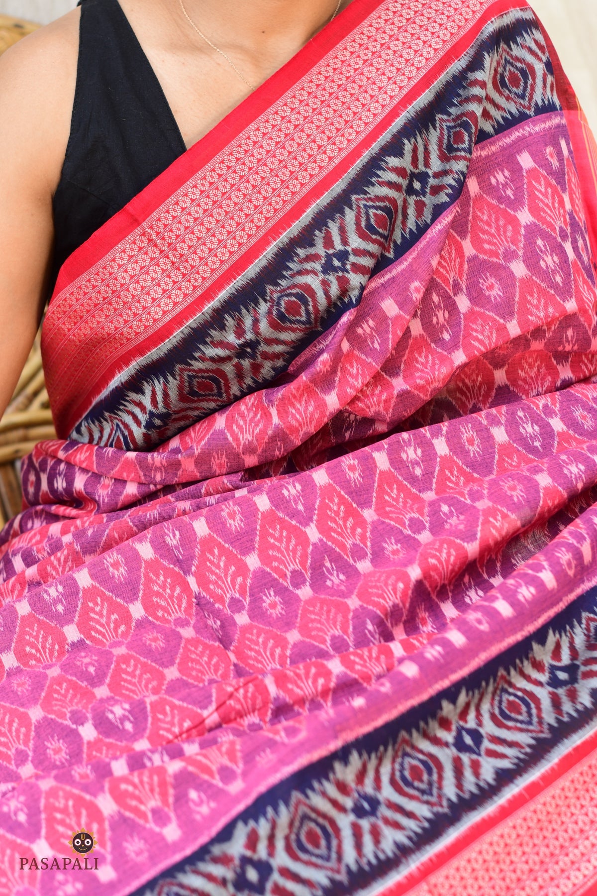 Front drape of Damayanti authentic Sambalpuri cotton saree — Bandhakala ikat weave in pink, Pasapali Odisha
