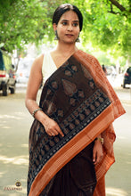 Load image into Gallery viewer, Texture close-up of Black Sambalpuri Mercerized Cotton saree by Pasapali — 120x120 thread count double ikat weave with a subtle natural sheen.
