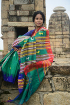 Deomali Kotpad handloom saree front drape in green, kumbha temple border detail, Pasapali Odisha