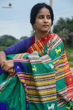 Deomali pallu detail — macha fish and pharsa axe tribal motifs, extra-weft weave, natural dye Kotpad textile