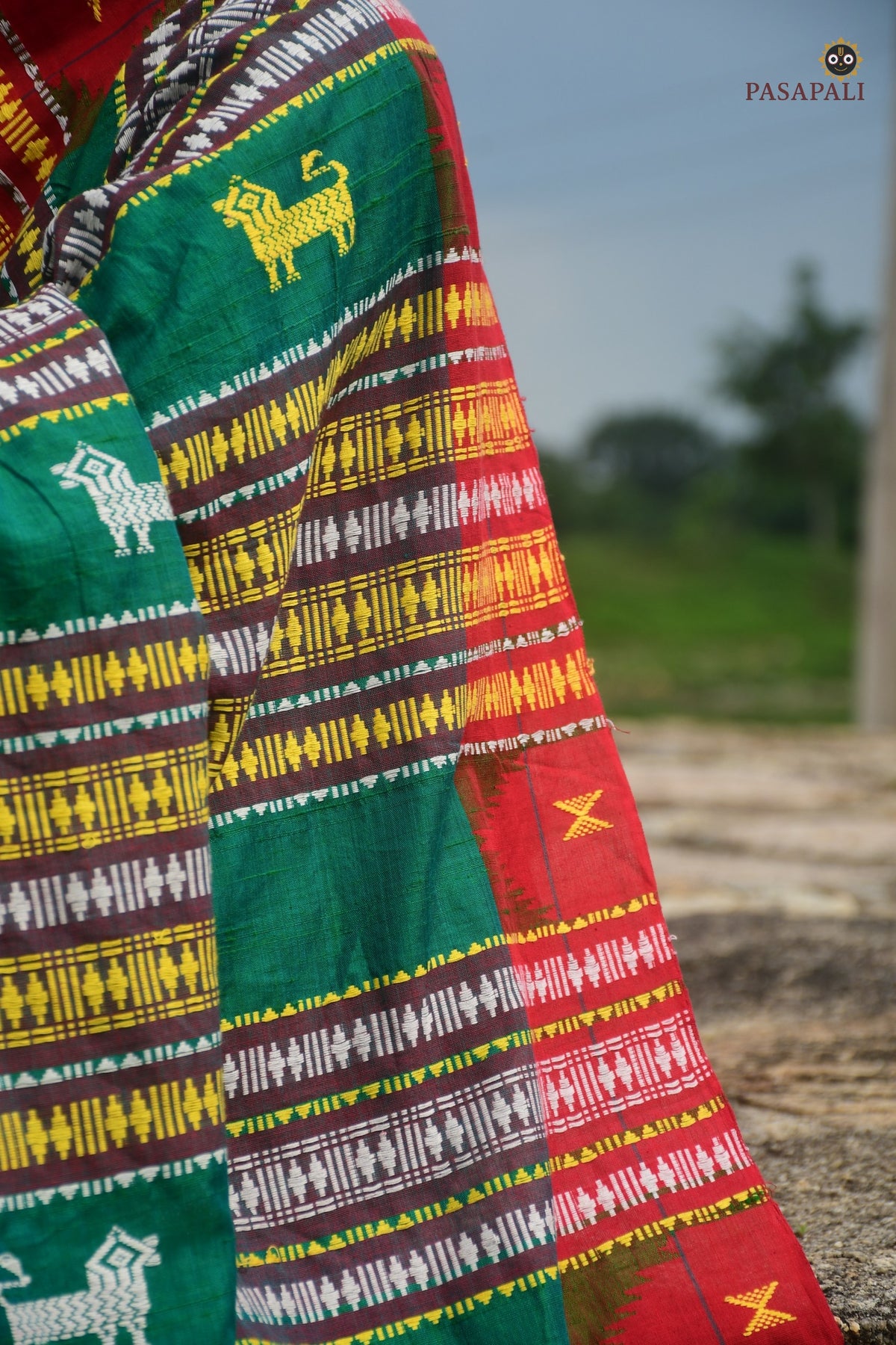 Body weave detail of Deomali Kotpad saree — pharsa and macha motifs on aal bark dyed green Tussar Cotton Silk