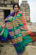 Texture detail of Deomali Tussar Cotton Silk Kotpad saree — handspun surface, vegetable dyed earthy green tone