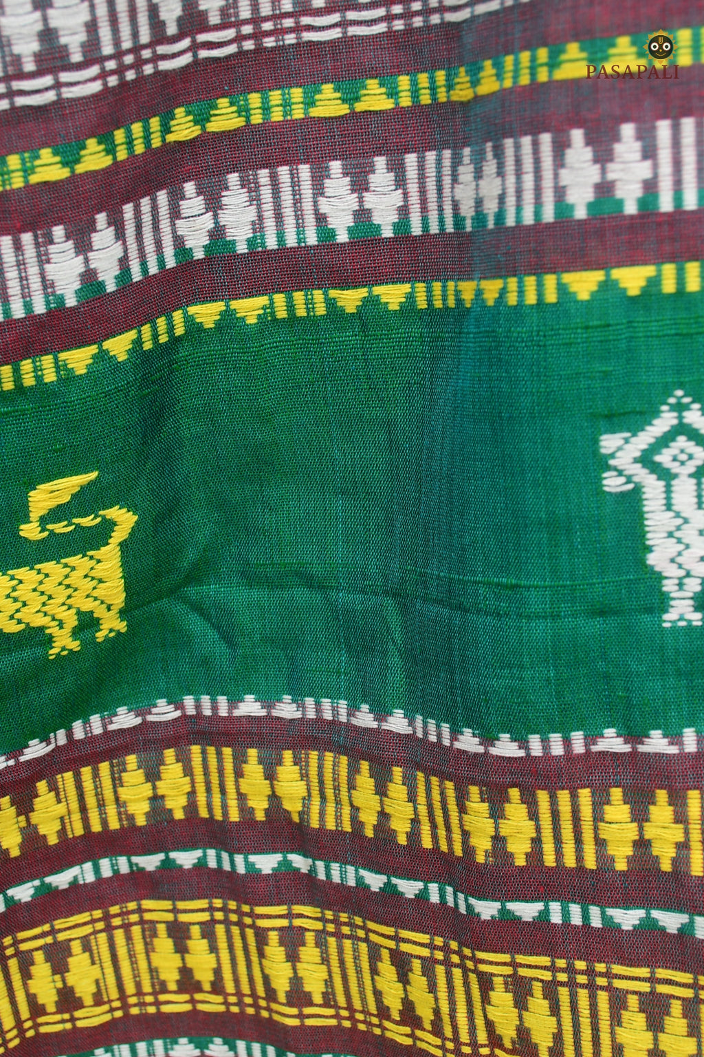 Motif detail — macha and pharsa tribal symbols on Deomali Kotpad saree body, extra-weft technique, Pasapali