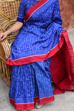Load image into Gallery viewer, Mercerized cotton texture close-up of Devyani Sambalpuri Bandha saree in blue — warp 120 weft 120, Pasapali
