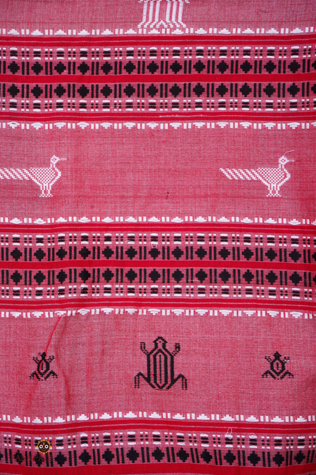 Dharani Kotpad saree body detail — pharsa axe motif woven extra-weft, vegetable dyed earthy dual shade fabric