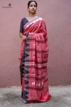 Dharani Kotpad saree border close-up — raised Kumbha temple motif, multi-shuttle interlocking, black contrast