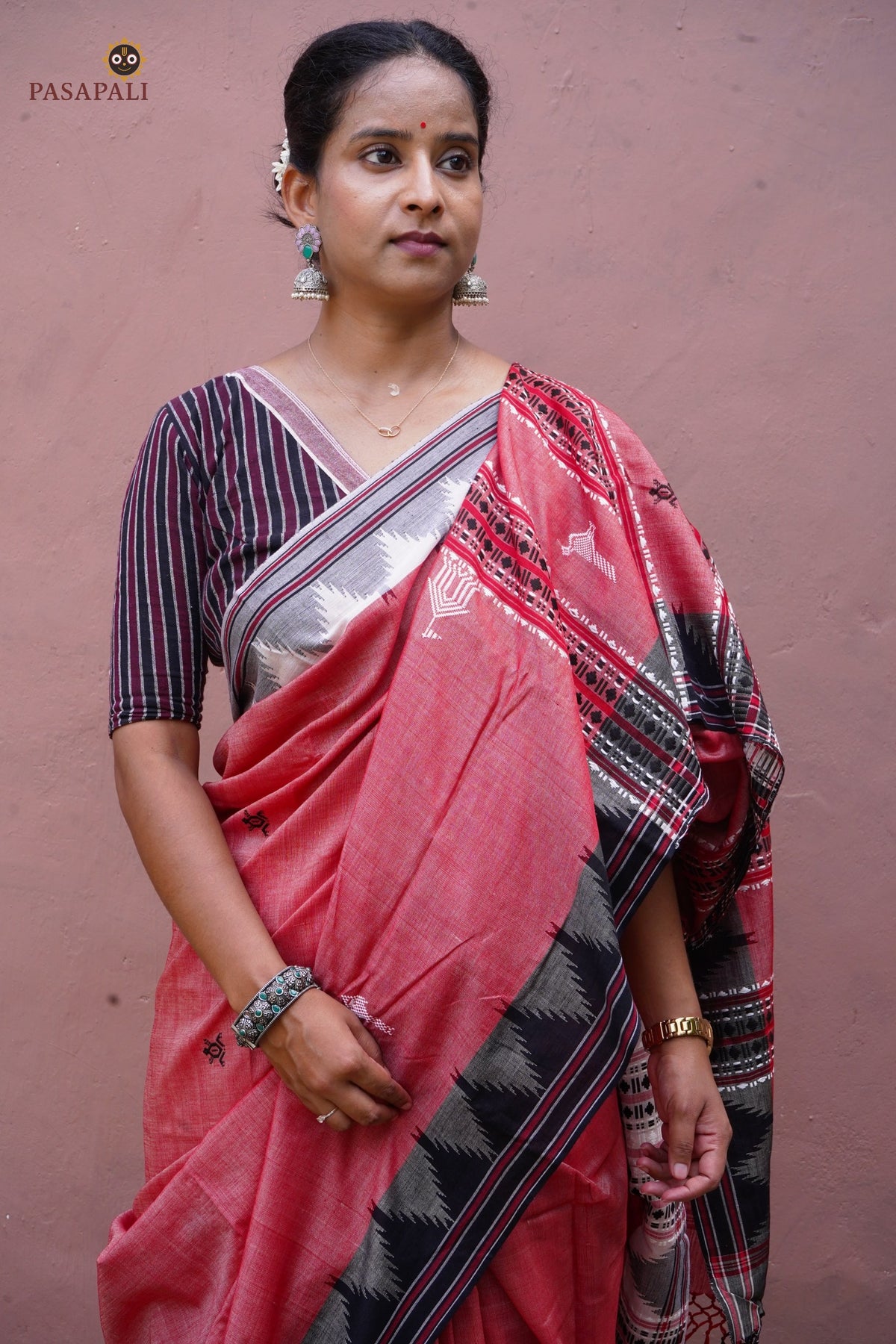 Dharani Kotpad handloom saree pallu detail — macha fish and pharsa axe tribal motifs, extra-weft technique