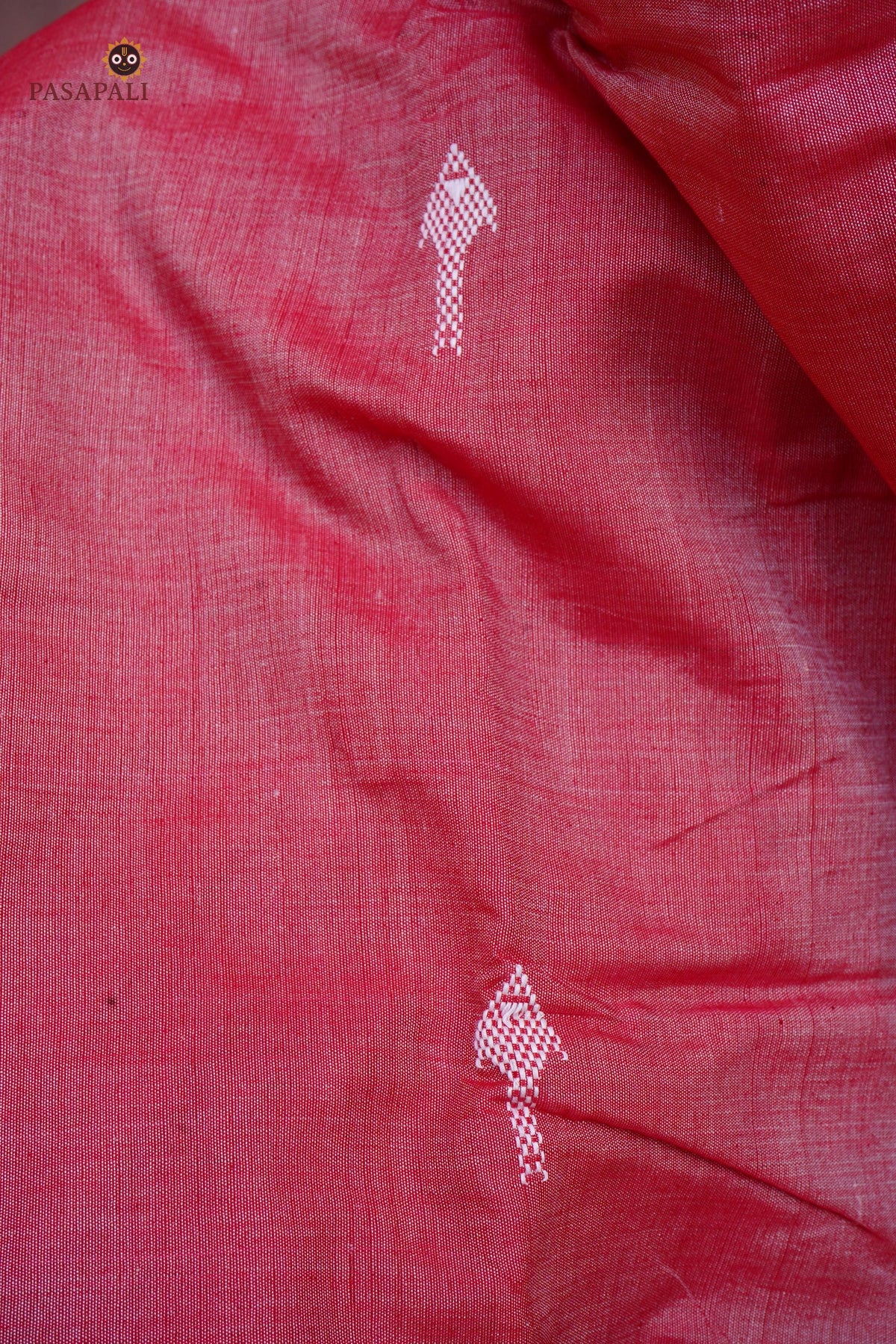 Dharani Kotpad saree motif detail — macha fish pharsa axe tribal symbols, extra-weft weave, aal bark colour