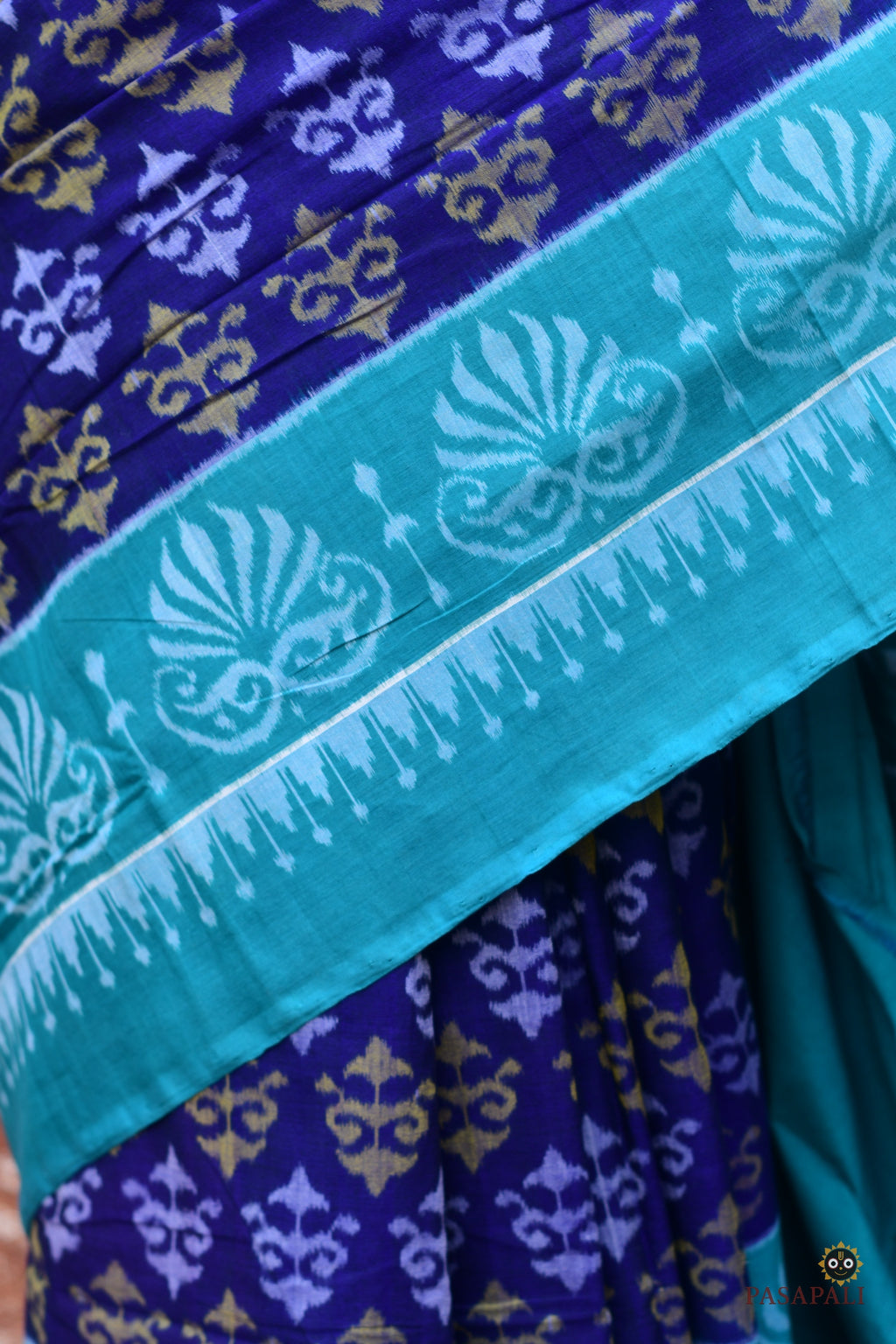 Flat lay of Draupadi Blue Sambalpuri Bandha mercerized cotton saree with blouse piece, Pasapali