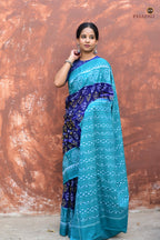Close-up of flower and kumbha border on Draupadi Blue Sambalpuri Bandha cotton saree, Pasapali Odisha