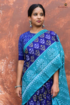 Body weave detail of Draupadi — flower motif double ikat on blue mercerized cotton, Bhulia handloom