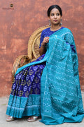 Draupadi Sambalpuri cotton saree folded — blue teal Bandha double ikat, kumbha motif border visible