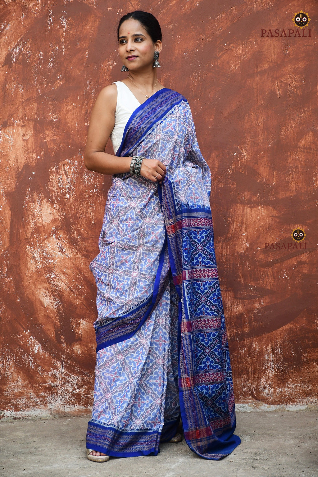 Indulekha Sambalpuri cotton saree — body weave detail showing geometric blue florals across white ground