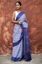 Indulekha Sambalpuri cotton saree — body weave detail showing geometric blue florals across white ground