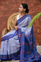 Indulekha white and blue Sambalpuri Bandha saree — handloom drape view, Bhulia weavers Odisha, Pasapali