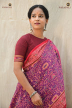 Janapadi Sambalpuri Bandha saree front drape — purple mercerized cotton with red accents and tribal body motifs.