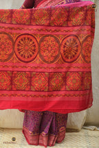 Konark Chakra motif detail on Janapadi pallu — Bandha double ikat precision on purple mercerized cotton.