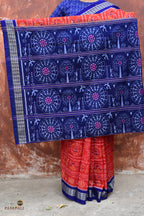 Flat lay of Kalapini orange Sambalpuri cotton saree showing full body, fish border and pallu, Pasapali