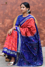 Kalapini orange-blue Sambalpuri cotton saree draped front view, fish motif border visible, Pasapali handloom