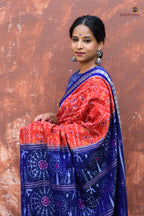 Close-up of fish motif border on Kalapini Sambalpuri Bandha cotton saree in orange and blue, Pasapali