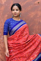 Body weave detail of Kalapini showing tribal motifs in orange mercerized cotton, Sambalpuri handloom, Pasapali