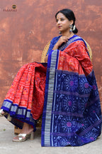 Kalapini Sambalpuri Bandha saree folded showing orange and blue colour with tribal and fish motifs, Pasapali