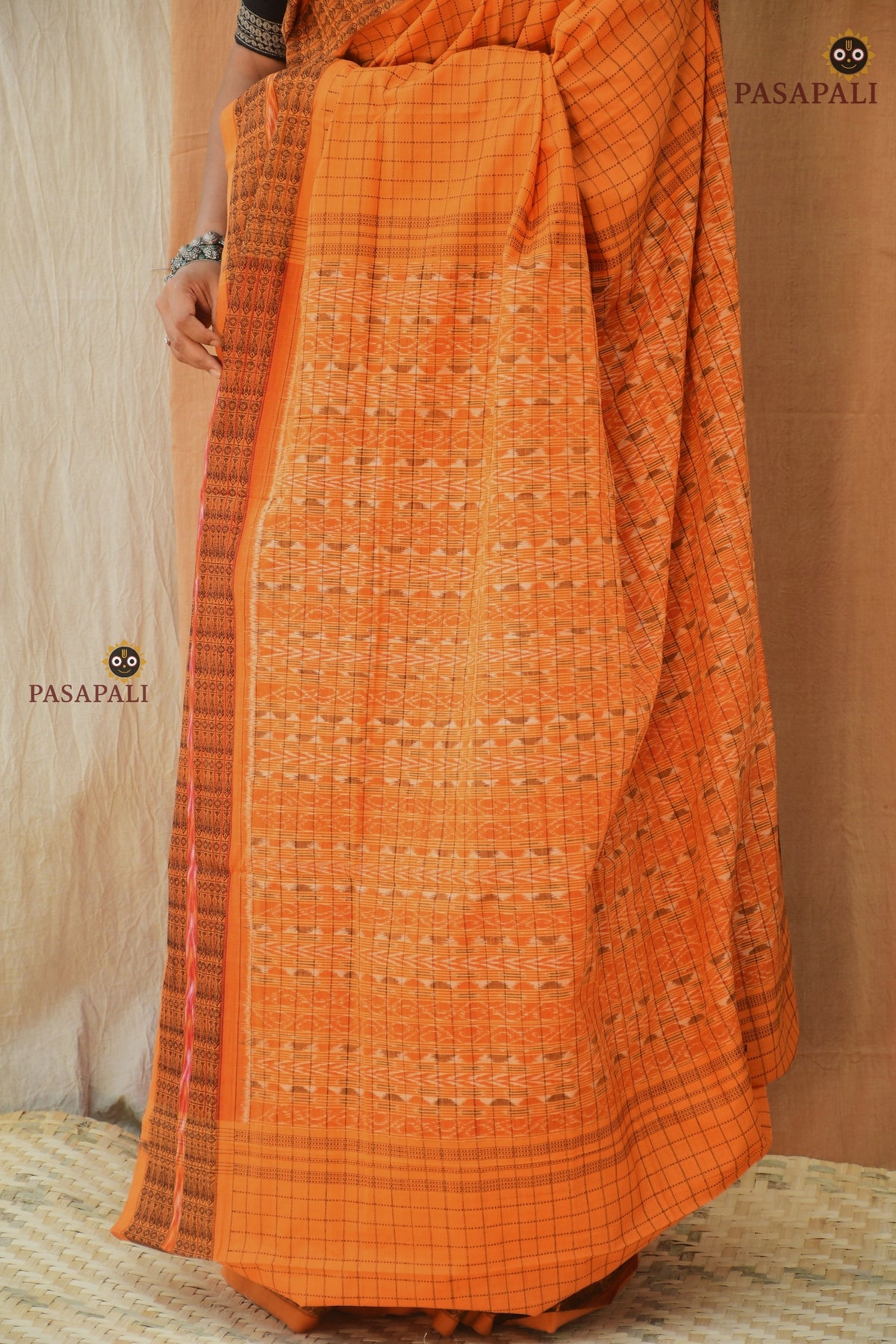 Kanakrekha saree drape front detail — daanti body with jala checks, Sambalpuri Bandha
