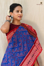 Flat lay of Kaumudi Blue Sambalpuri Bandha mercerized cotton saree — full 5.4 metre length with pallu and border