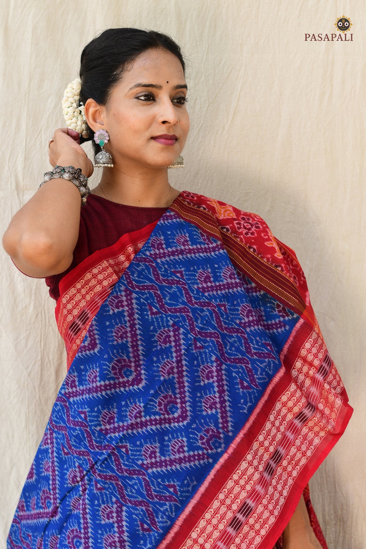 Flat lay of Kaumudi Blue Sambalpuri Bandha mercerized cotton saree — full 5.4 metre length with pallu and border