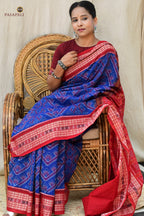 Front drape of Kaumudi Blue Sambalpuri Bandha saree showing double ikat chevron pattern and red border detail