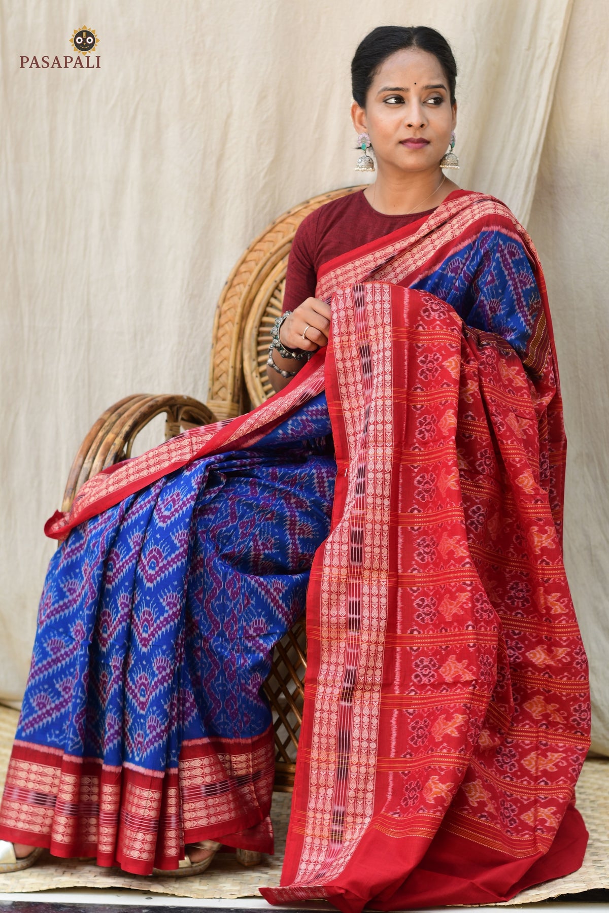 Folded view of Kaumudi Blue Sambalpuri Bandha mercerized cotton saree showing GI certified handloom weave layers