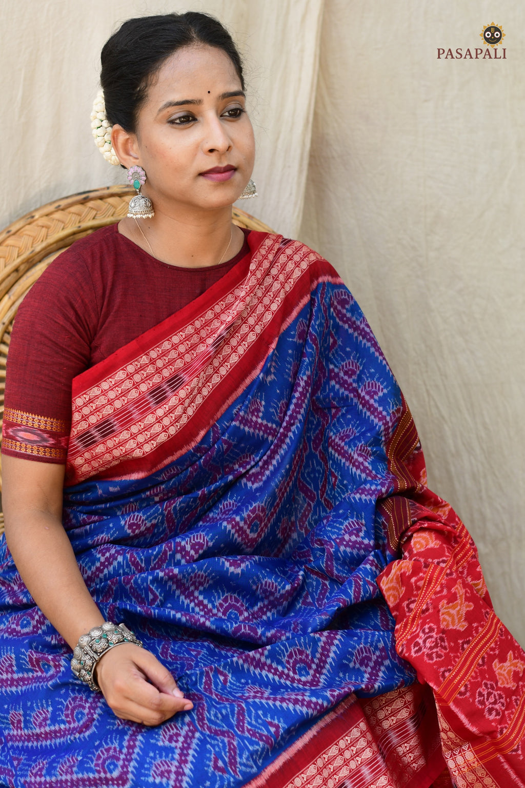 Handloom drape view of Kaumudi Sambalpuri cotton saree by Pasapali — chevron body with fish border in motion